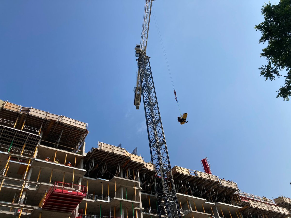 The Ottawa Fire Services rope rescue team worked with the crane operator at a Rideau Street construction site on Thursday morning to save a man in medical distress atop the structure.