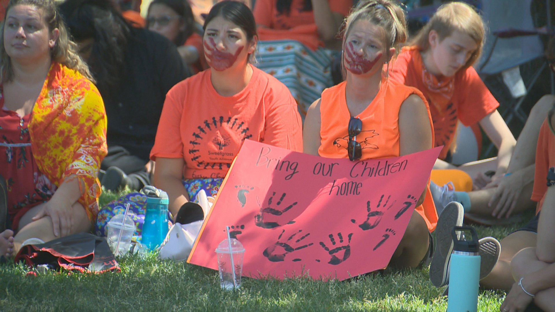 Participants listen to speeches at Lethbridge\’s Indigenous awareness rally on July 1, 2021.