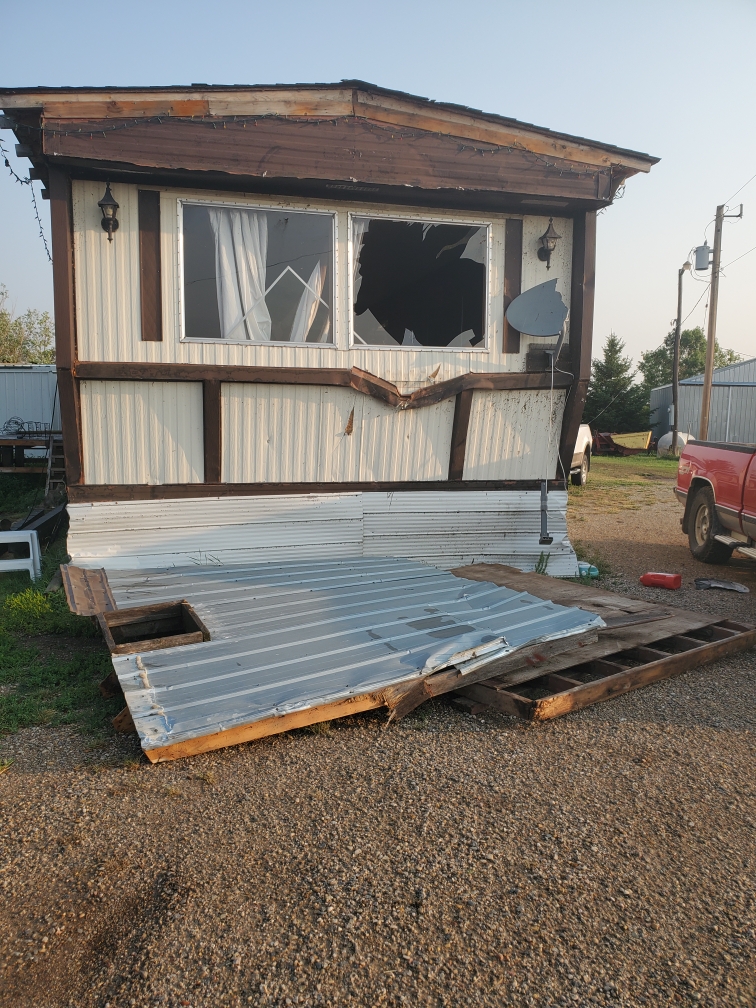 A couple living near Cromer, Man., are picking up the pieces after a volatile Saturday night storm peeled part of the roof off their home and caused other destruction.