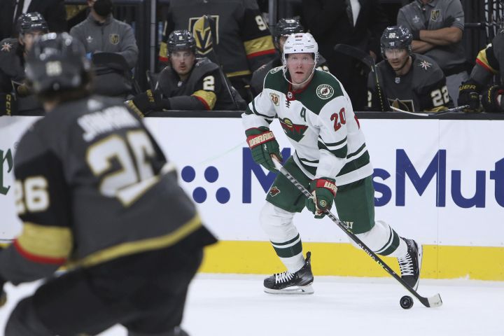 Minnesota Wild defenseman Ryan Suter (20) looks to pass the puck against the Vegas Golden Knights during the first period of Game 7 of an NHL hockey Stanley Cup first-round playoff series Friday, May 28, 2021, in Las Vegas.