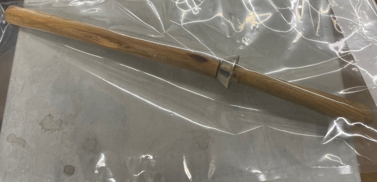 Swan River RCMP say a man carrying a large sword was arrested Thursday.