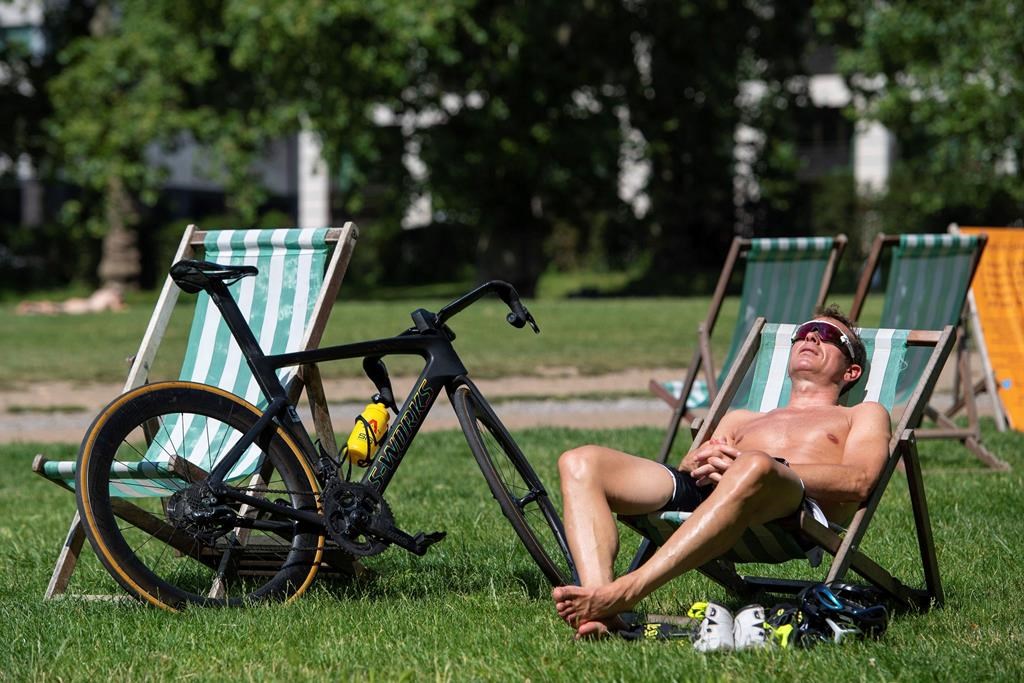 Amid record-breaking temperatures Thursday, officials in London Ont., urge people to find ways to stay cool. (Dominic Lipinski/PA via AP).