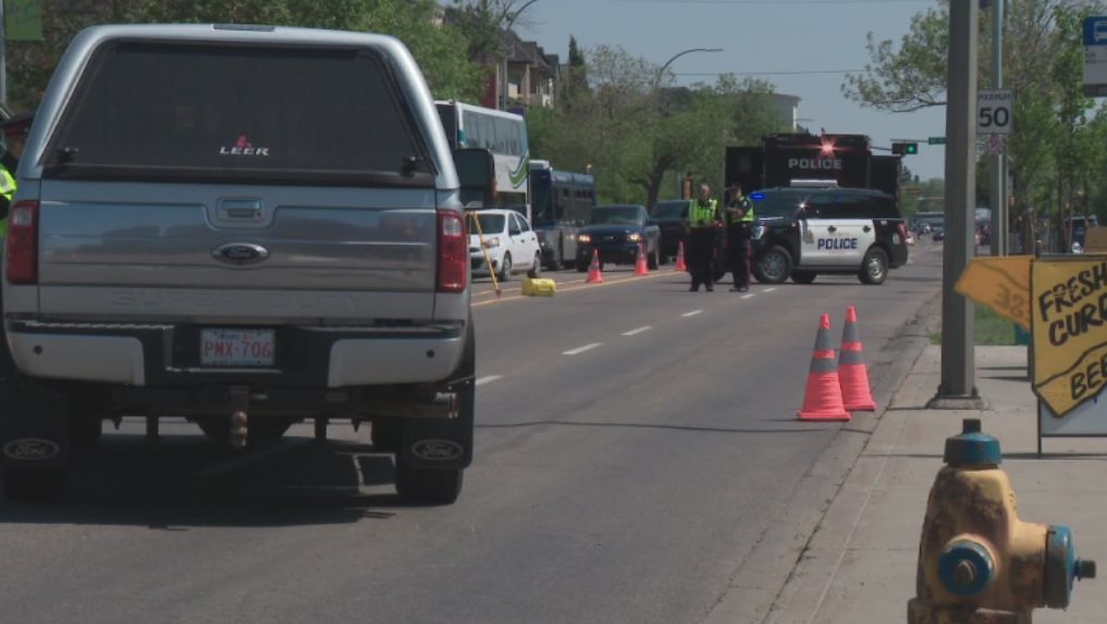 Edmonton police investigate a serious collision involving a pedestrian on Whyte Avenue, Wednesday, July 7, 2021. 