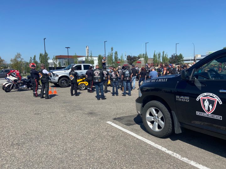 Around 80 riders gather at Deerfoot City as they prepare to escort the family of Matt Forseth to a Calgary funeral home.