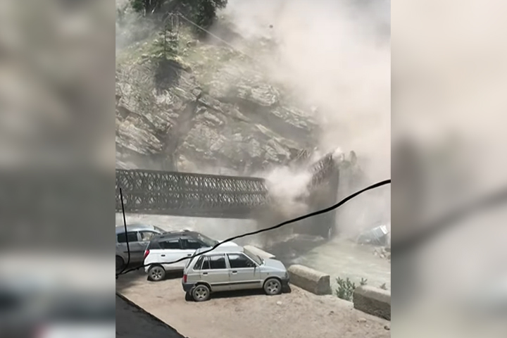 A landslide destroys a bridge in this image from video captured in the village of Batseri, northern India on July 25, 2021.