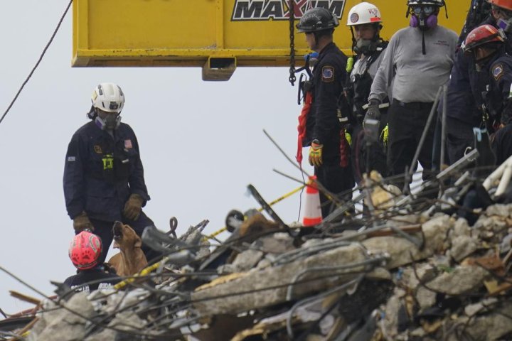 Rescue efforts at Florida condo collapse paused over safety concerns