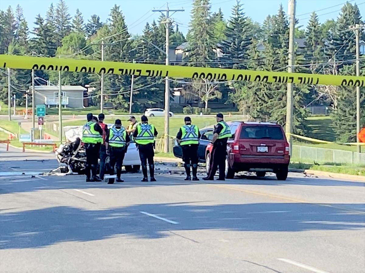 Calgary police investigate a fatal two-vehicle crash on 14 Street Northwest on Friday, July 9, 2021. 