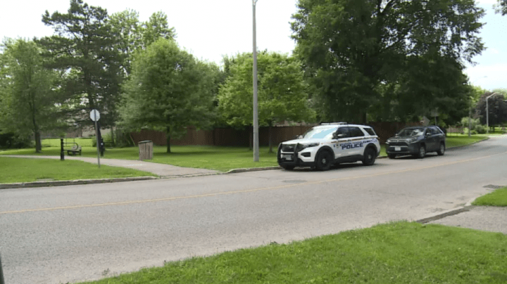 Police are seen in the area of Harwood Avenue and Clements Road East.