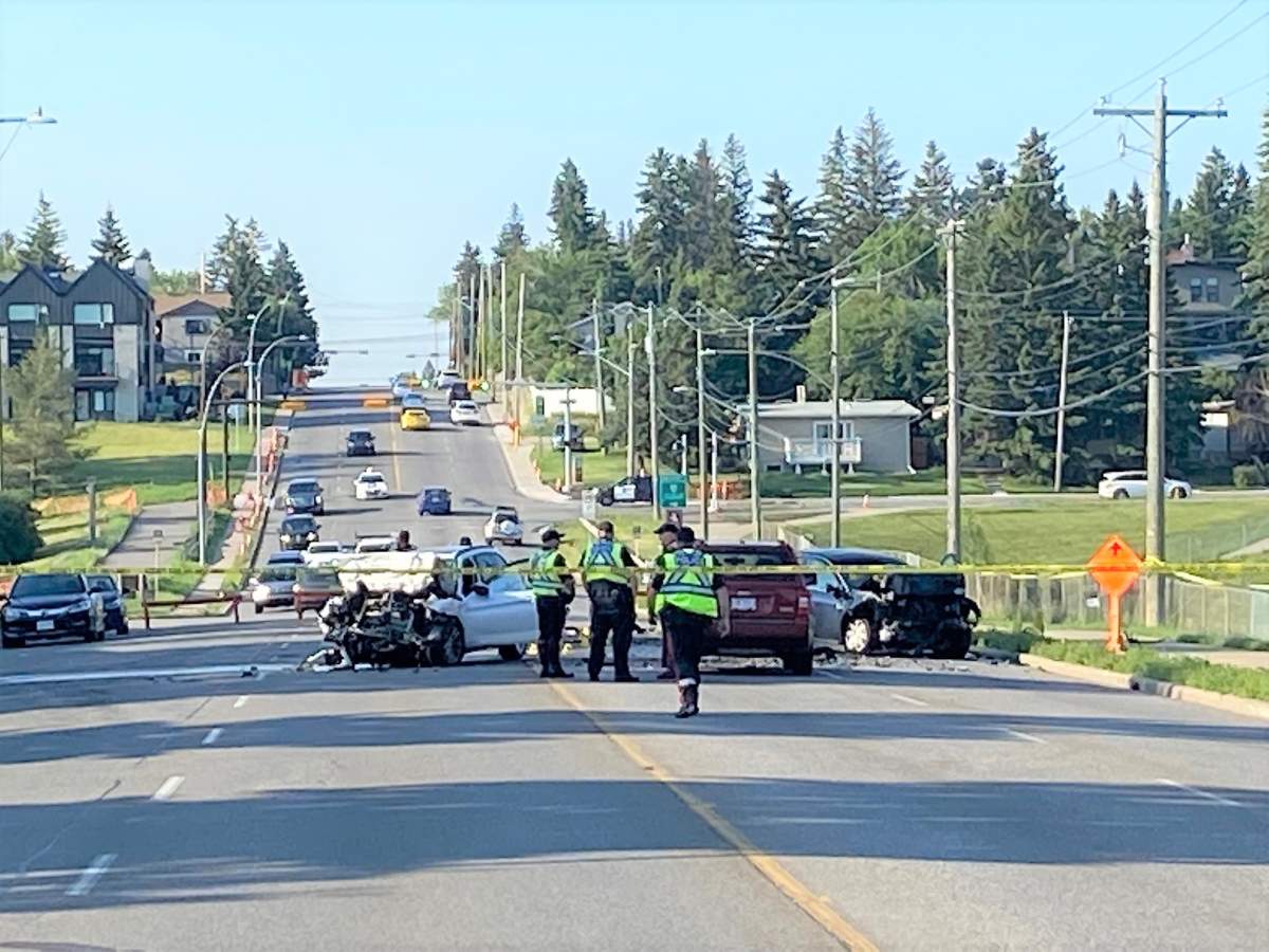 Calgary police investigate a fatal two-vehicle crash on 14 Street Northwest on Friday.