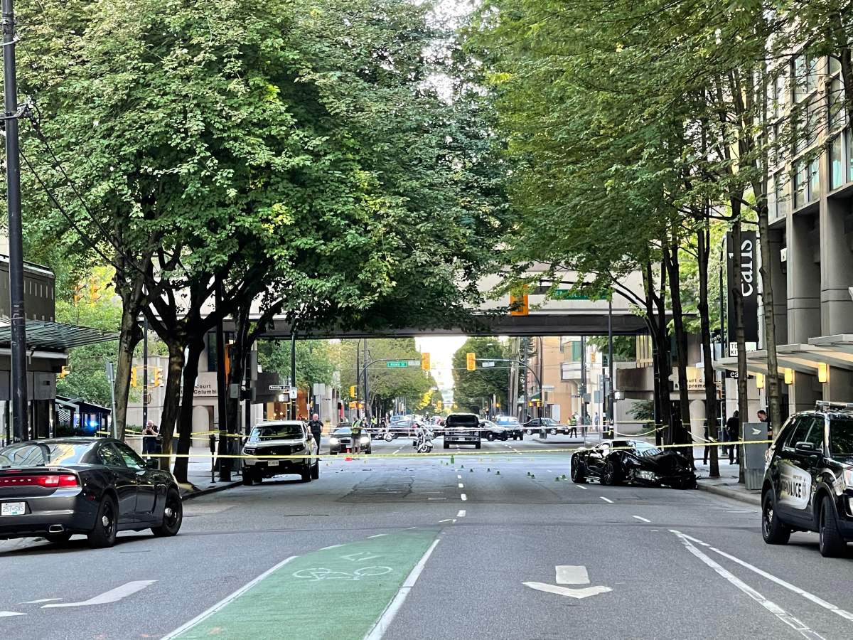 The scene of a two-vehicle collision that caused one vehicle to crash into a pedestrian and his 11-month-old baby on July 6, 2021. Police say the baby was killed in the collision and the father was sent to hospital with unknown injuries.