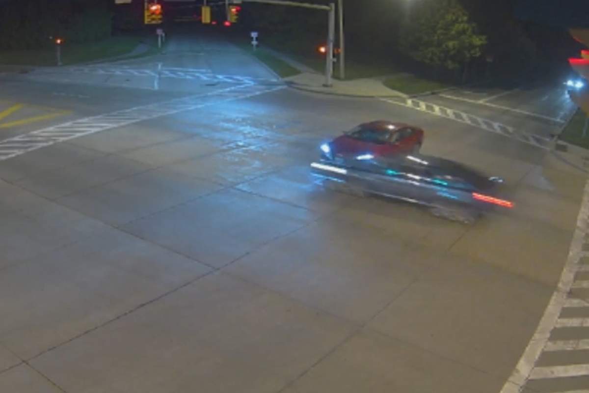A vehicle, right, runs through an intersection in front of another car just before midnight on June 15 in Beachwood, Ohio, in this image from traffic cam video.