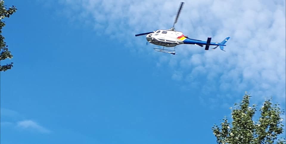 An RCMP helicopter on scene at Long Lake, Alta., on Saturday afternoon.