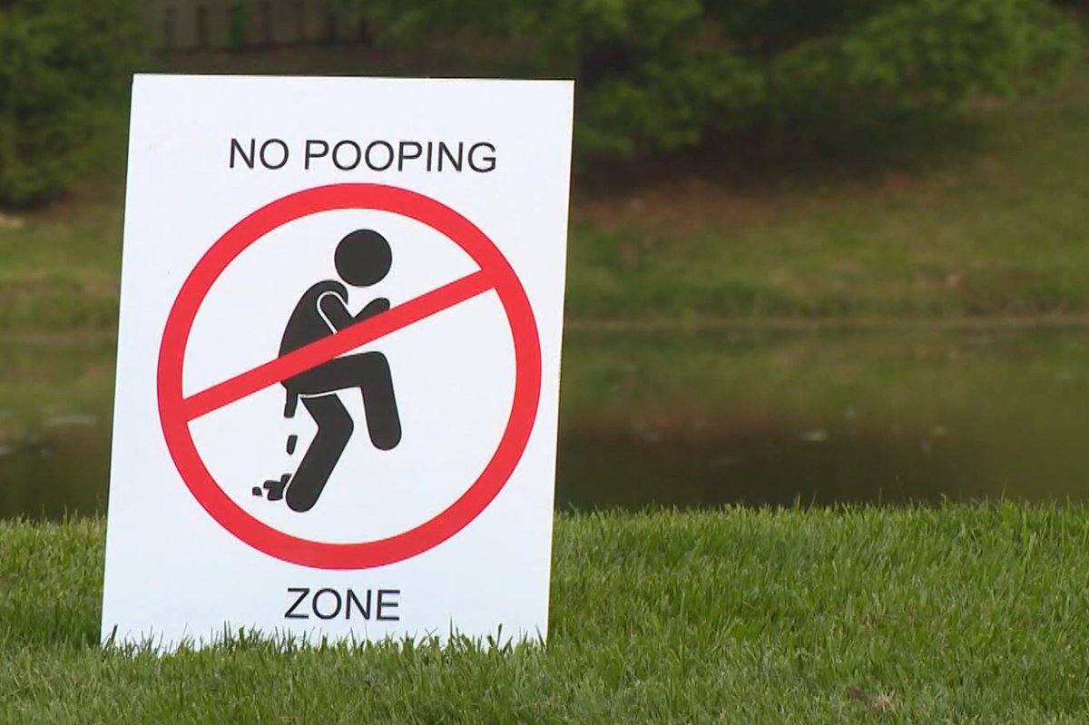 A "No pooping" sign is shown in the Windermere neighbourhood of Fishers, Ind., on July 21, 2021.