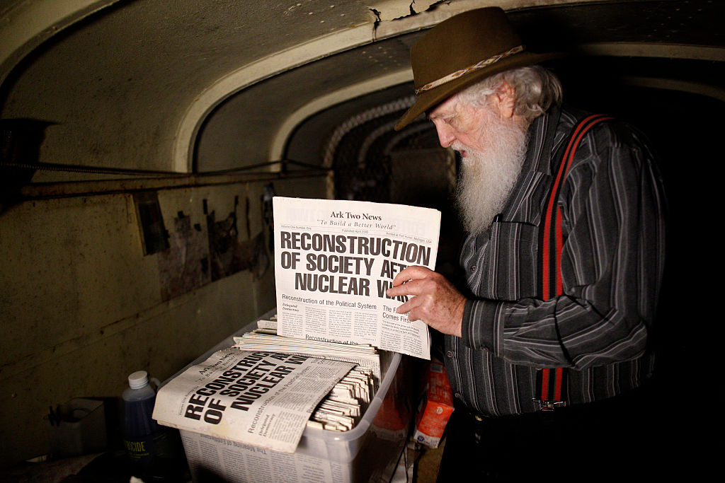 Bruce Beach shows a copy of his newspaper in his fallout shelter in Horning’s Mills on July 9, 2015.