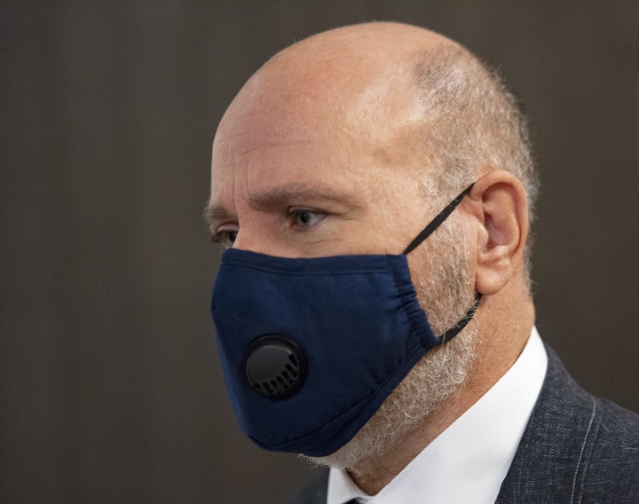 Montreal police officer Roger Frechette leaves the courtroom for the lunch break in his sexual assault trial, Tuesday, July 13, 2021 in Montreal.