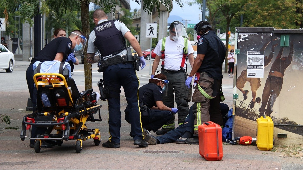 First responders on the scene of a police incident at the Surrey Central bus loop on Friday.