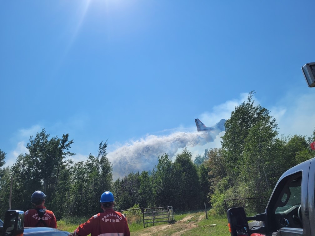 Water bombers over Tanya Dirk's property on July 1 in Tomahawk.