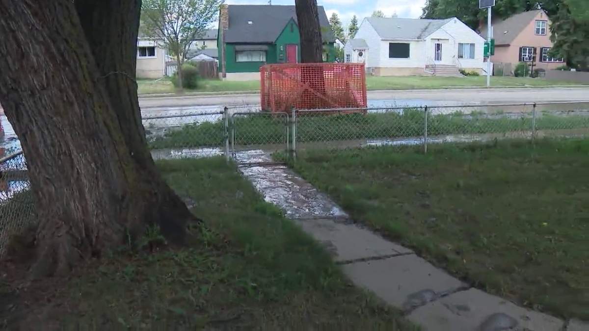 Thick mud covers properties in the area of 101 Street and 116 Avenue in Edmonton Monday, July 5, 2021, one day after a water main break in the area.