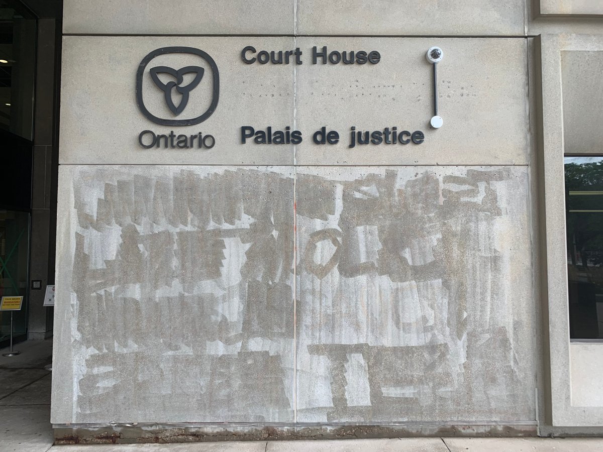 The cleaned-up graffiti on London's courthouse, Aug. 25, 2021.