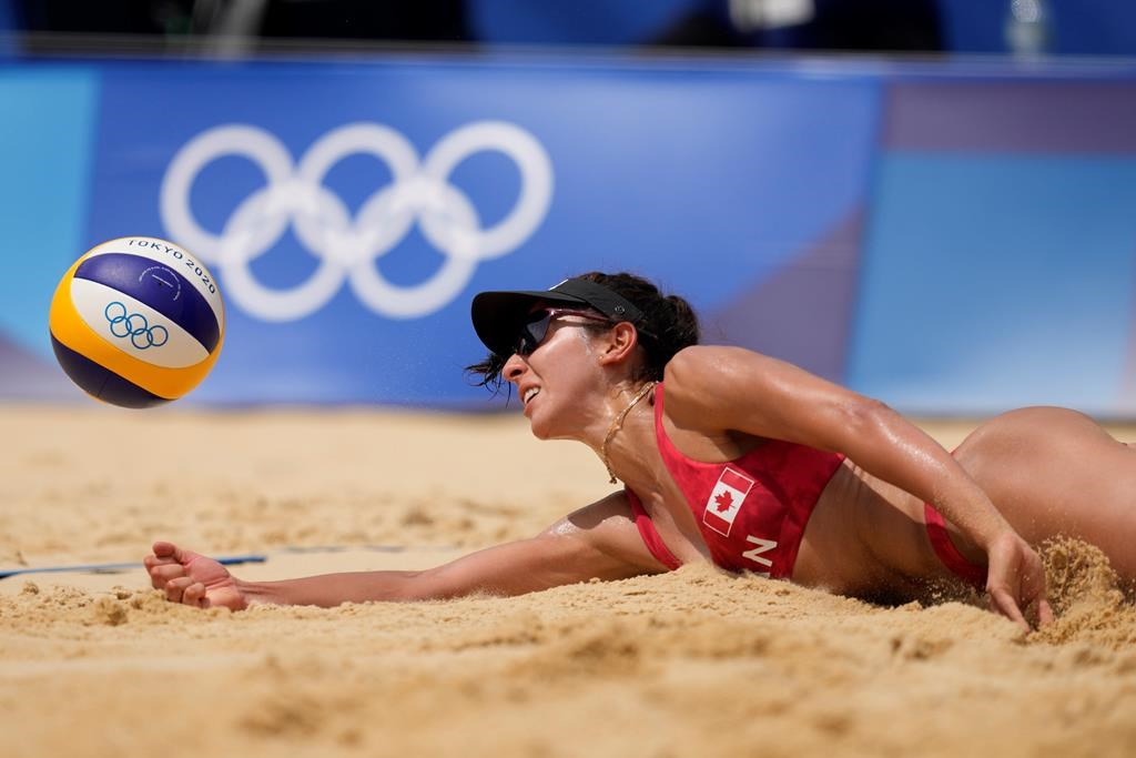 Melissa Humana-Paredes, of Canada digs out the ball during a women’s beach volleyball match against Spain at the 2020 Summer Olympics, Monday, Aug. 2, 2021, in Tokyo, Japan. (AP Photo/Petros Giannakouris)