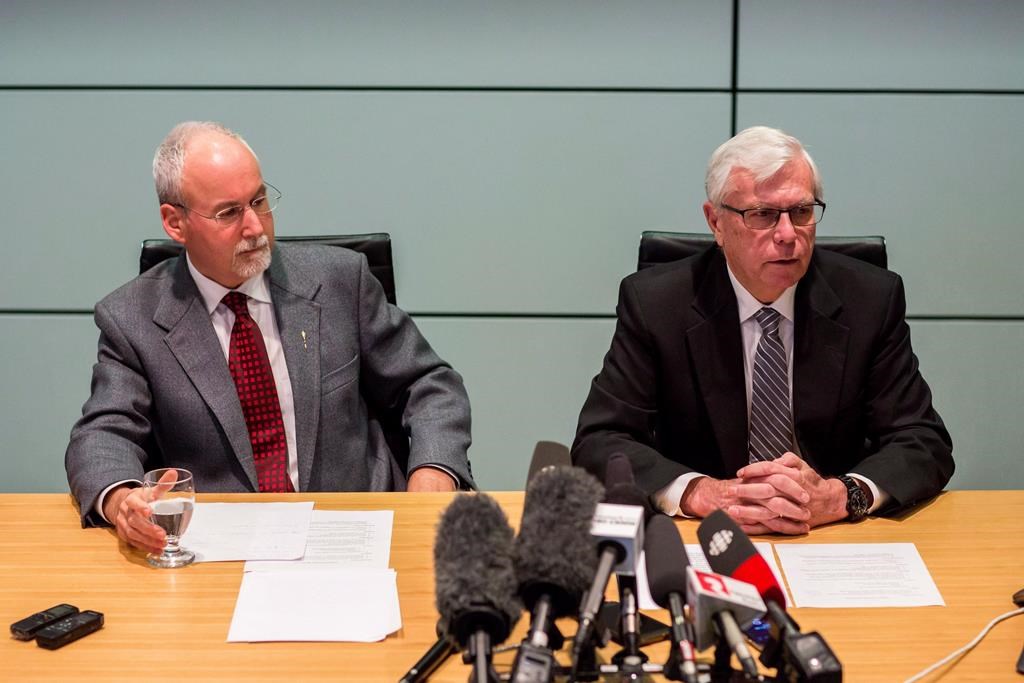 Sergeant-at-Arms Gary Lenz, left, and Clerk of the Legislative Assembly Craig James make a statement to media in Vancouver, B.C., Monday, Nov. 26, 2018. British Columbia's Prosecution Service says no further charges will be recommended following an RCMP investigation into spending activities of senior staff at the legislature. THE CANADIAN PRESS/Ben Nelms.