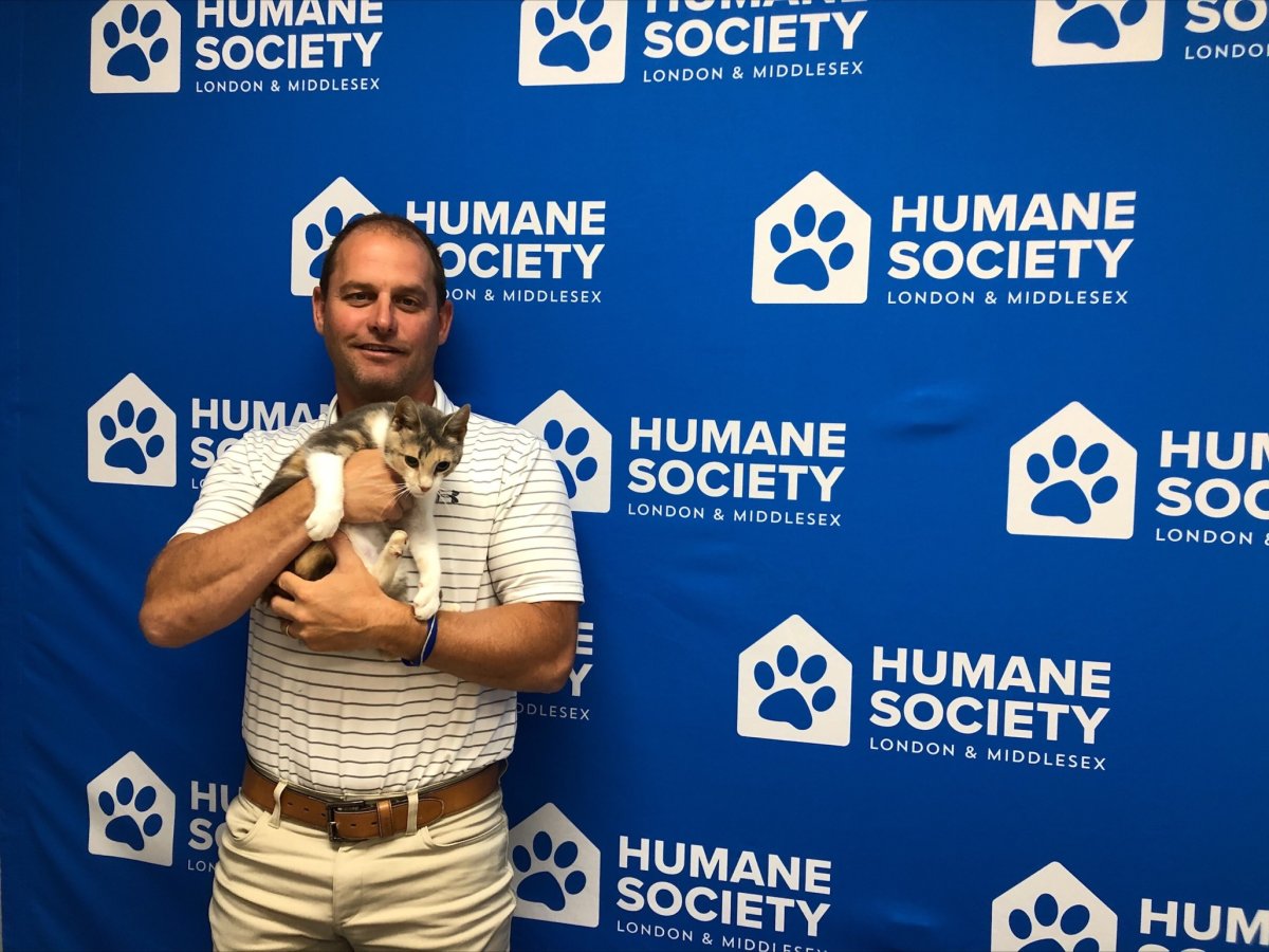 Steve Ryall, executive director of the Humane Society of London & Middlesex, holds nine-month-old Lavender on Aug. 20, 2021.