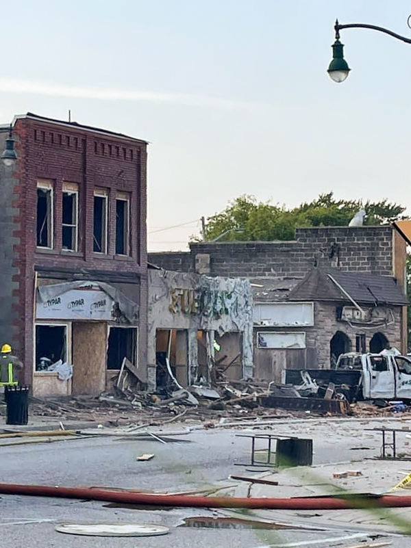 Damaged buildings across the street from the scene of the explosion in Wheatley, Ont., Aug. 26, 2021