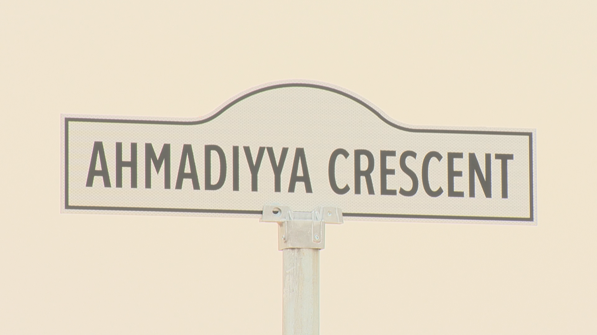 The new sign for Ahmadiyya Crescent. 