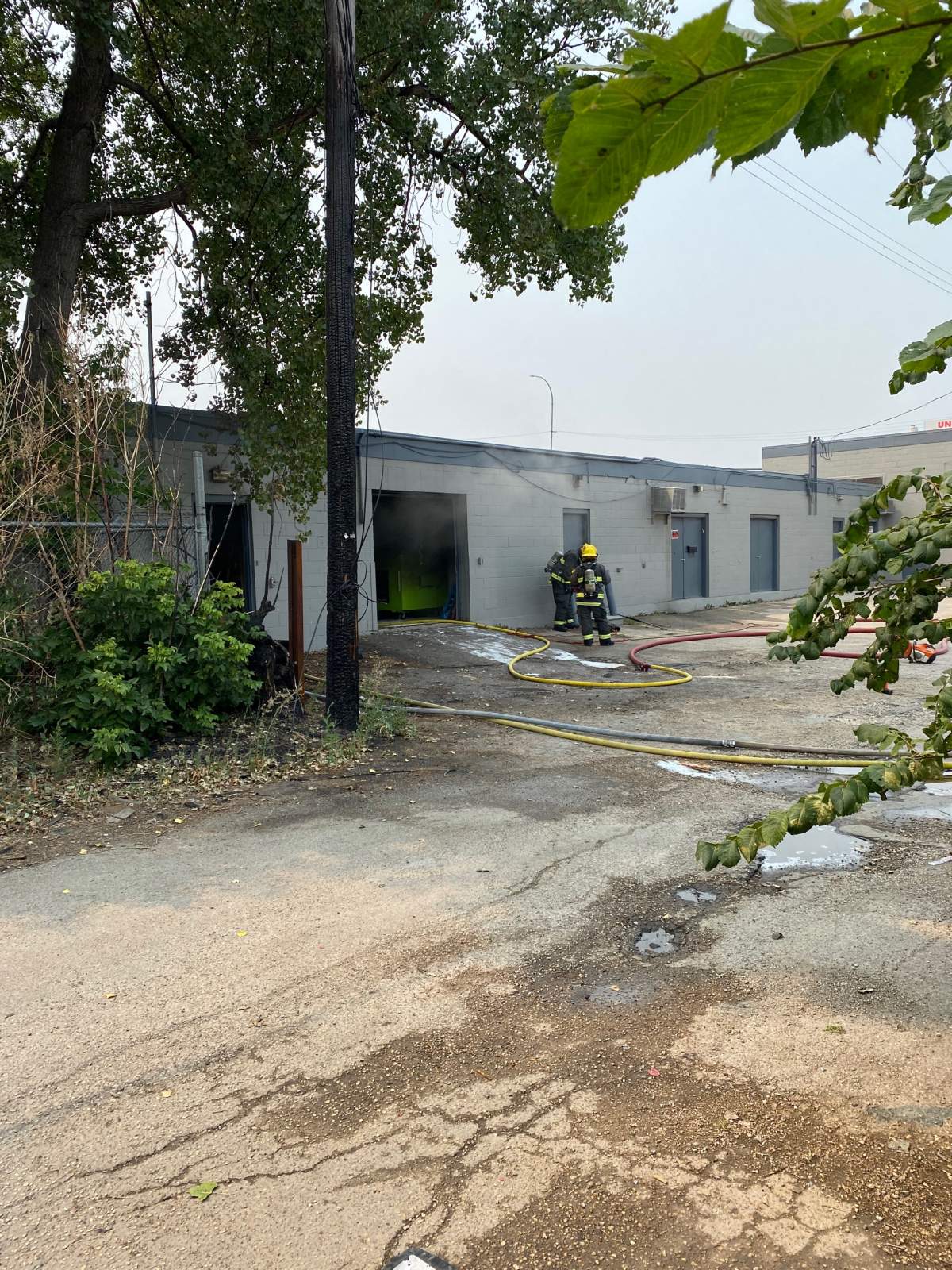Winnipeg emergency services vehicles blocked traffic on Dufferin Avenue early Monday afternoon, while smoke could be seen coming from a nearby business.