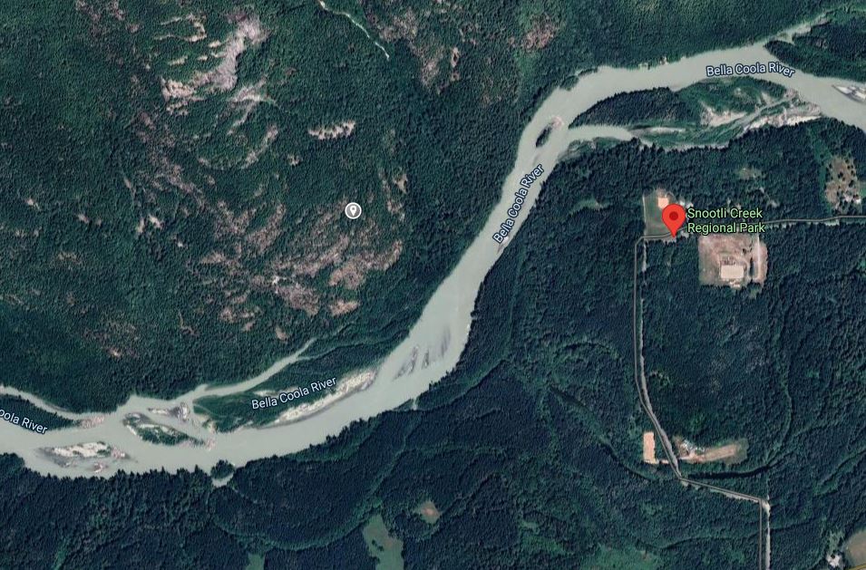 The fishing boat was spotted partially capsized on the Bella Coola River near Walker Island Park. 
