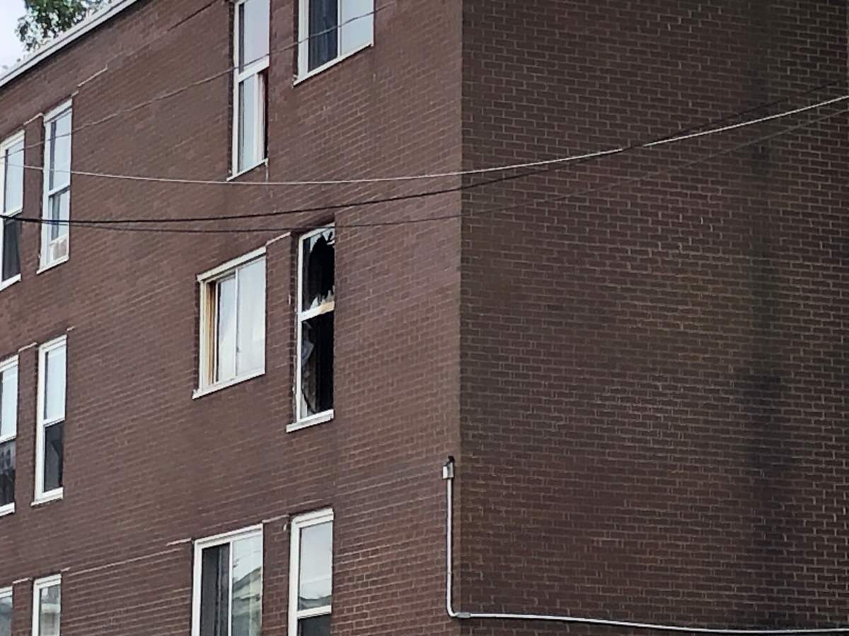 A window at an apartment building on Britain Street in Saint John, N.B., damaged after a fire.