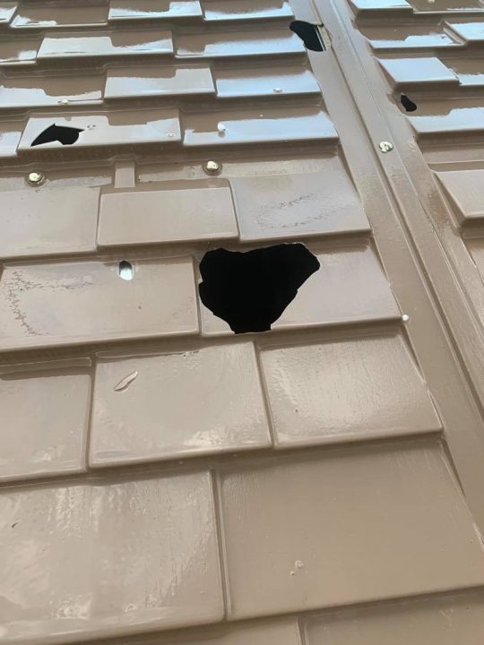 Hail damage on a shed roof in Assiniboia.