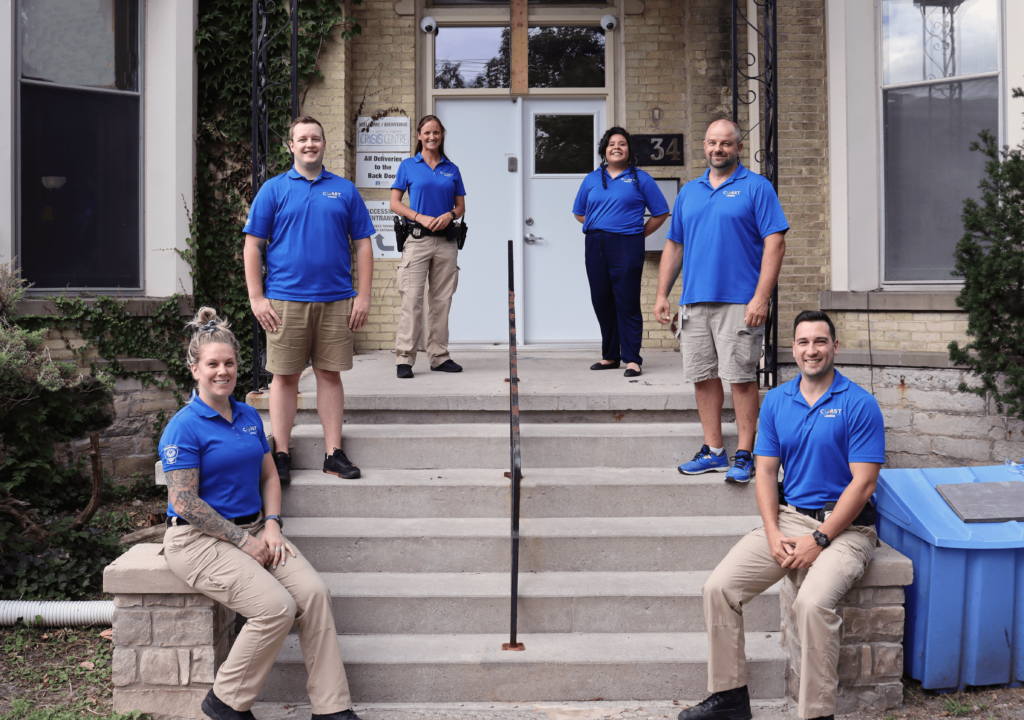 Six members of the 15-member COAST pilot, photographed outside of CMHA Middlesex's Queens Avenue offices.