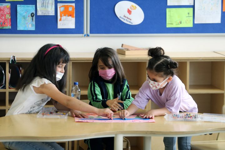 Children wearing face masks paint in a kindergarten in Ankara, Turkey, on June 1, 2021. 