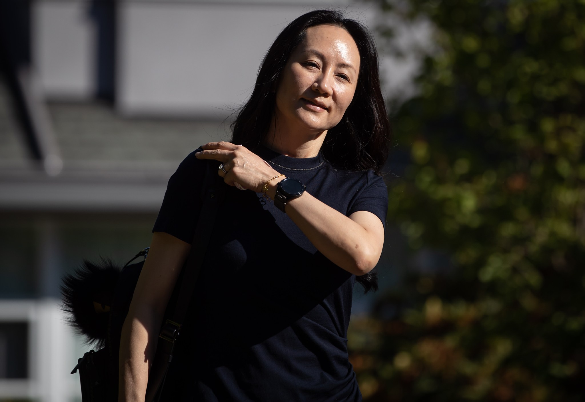 Meng Wanzhou, chief financial officer of Huawei, leaves home to attend her extradition hearing at B.C. Supreme Court, in Vancouver, on Aug. 5, 2021.