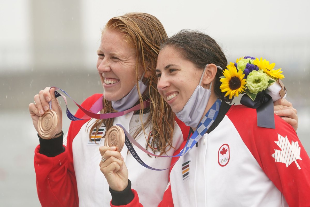 Laurence Vincent Lapointe, left, and Katie Vincent celebrate after winning the bronze medal in the women’s canoe double 500m finals during summer Tokyo Olympics in Tokyo, Japan on Saturday, August 7, 2021. THE CANADIAN PRESS/Nathan Denette.