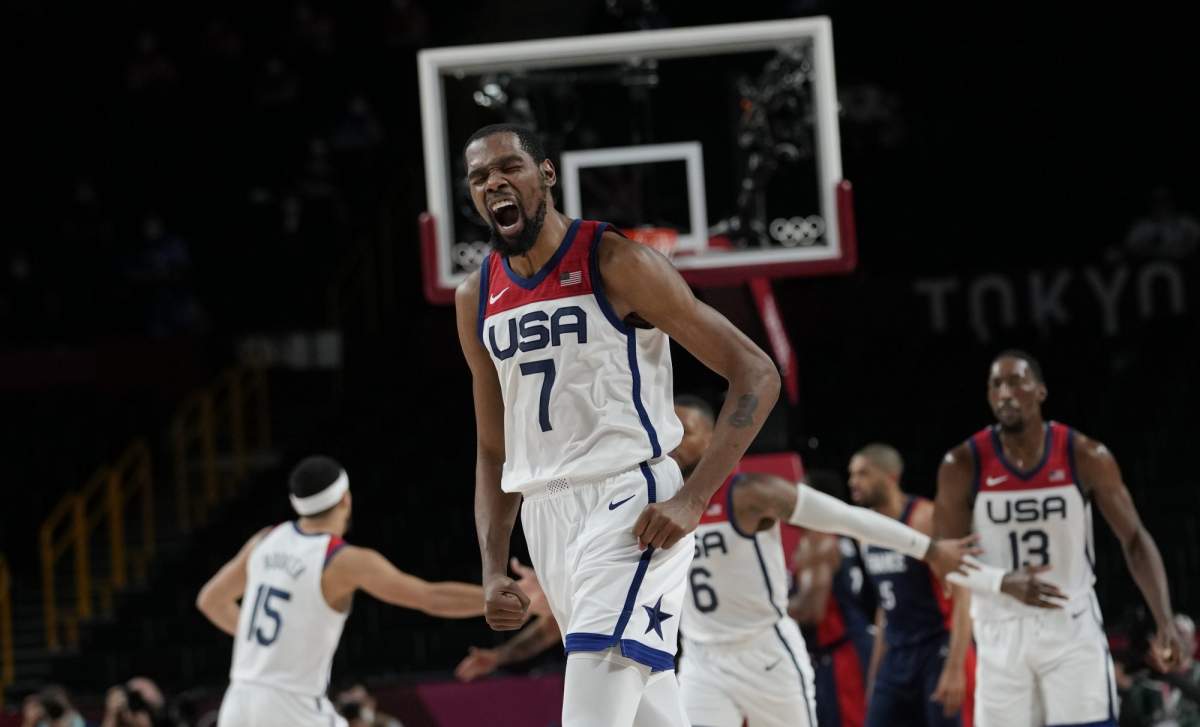 United States' Kevin Durant (7) celebrates after a score during men's basketball gold medal game against France at the 2020 Summer Olympics, Saturday, Aug. 7, 2021, in Saitama, Japan. (AP Photo/Eric Gay).
