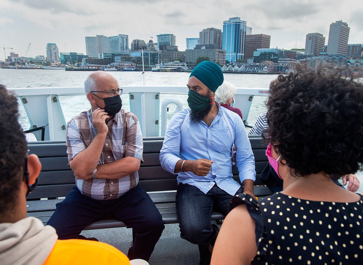 Federal NDP leader Jagmeet Singh, right, and Nova Scotia NDP leader Gary Burrill take the ferry to Dartmouth from Halifax on Wednesday, Aug. 11, 2021.