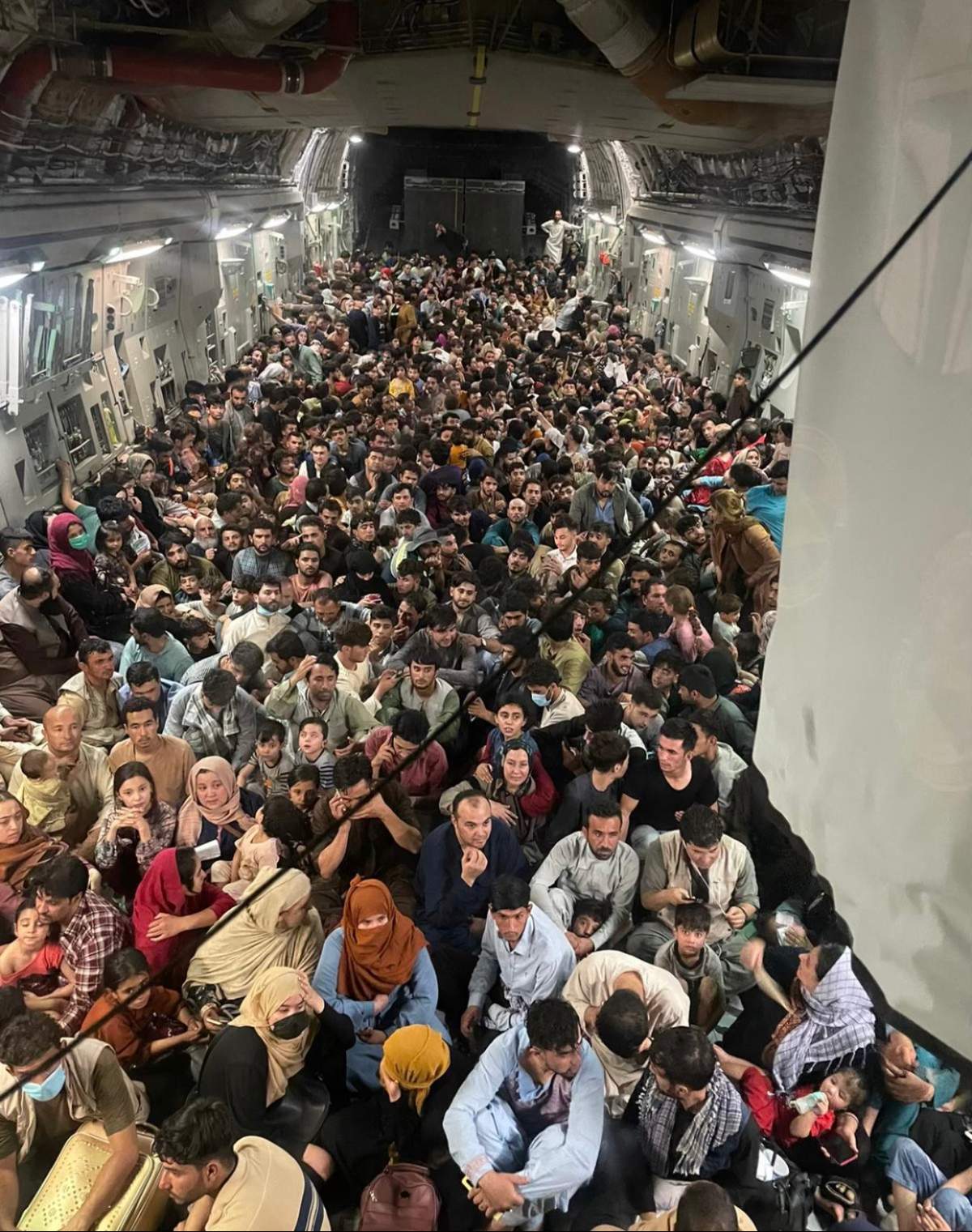 Approximately 640 Afghan citizens pack inside a United States Air Force C-17 Globemaster III, to be safely transported from Hamid Karzai International Airport in Afghanistan, Sunday, August 15, 2021. Photo by Chris Herbert/U.S. Air Force via CNP/ABACAPRESS.COM
