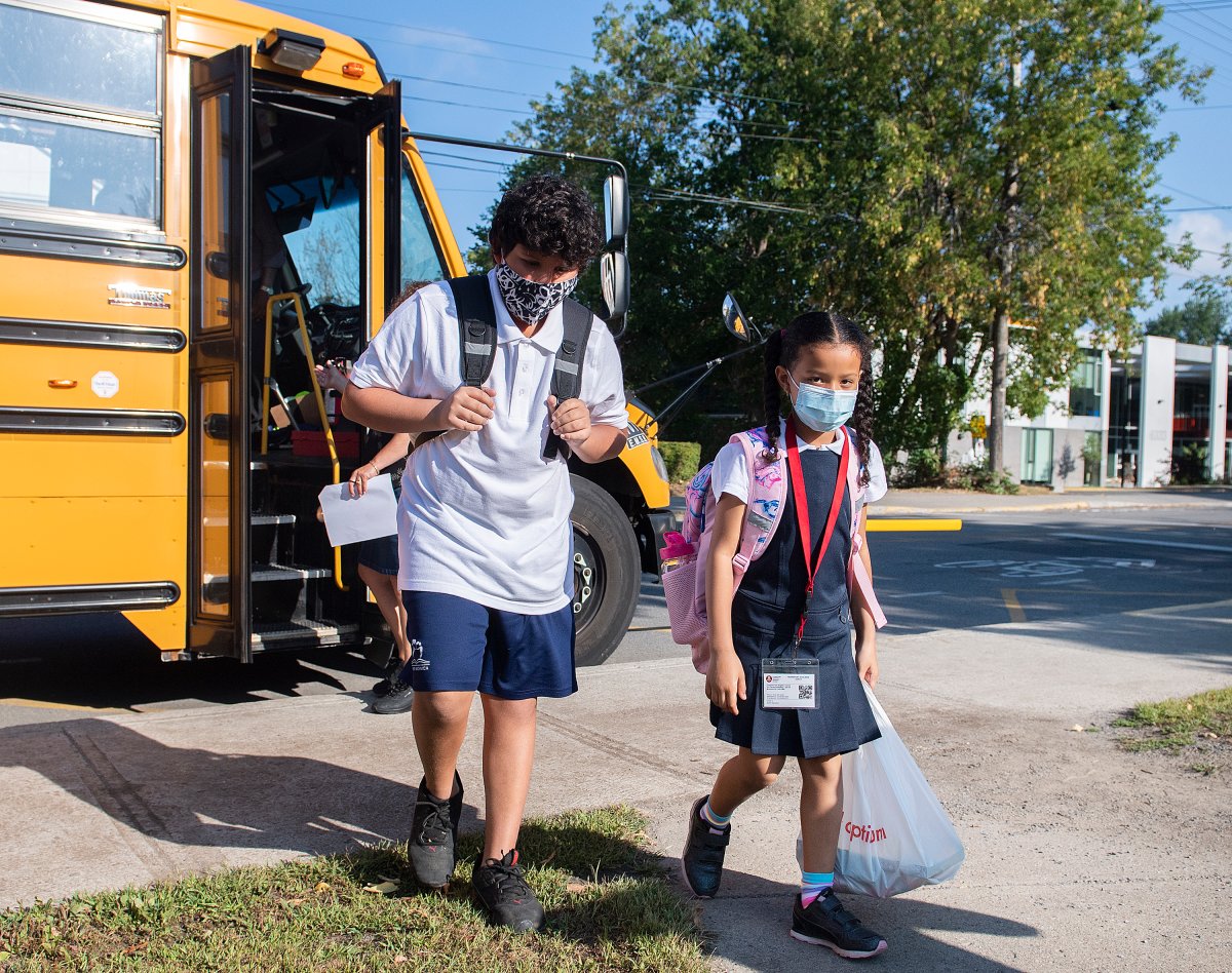 Students arrive for the first day of school in Montreal, Tuesday, August 31, 2021, as the COVID-19 pandemic continues in Canada and around the world. 
