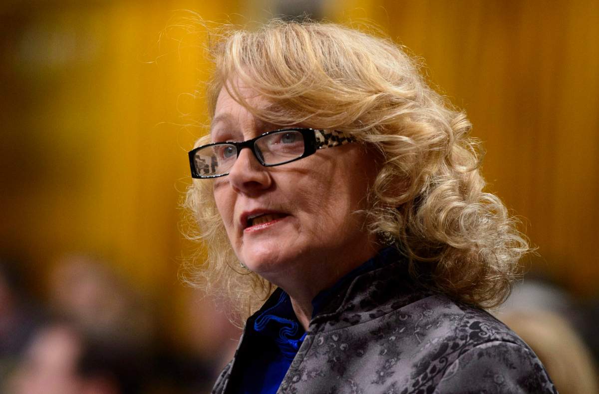 Liberal MP Karen McCrimmon stands during question period in the House of Commons on Parliament Hill in Ottawa on Monday, Oct. 22, 2018. 
