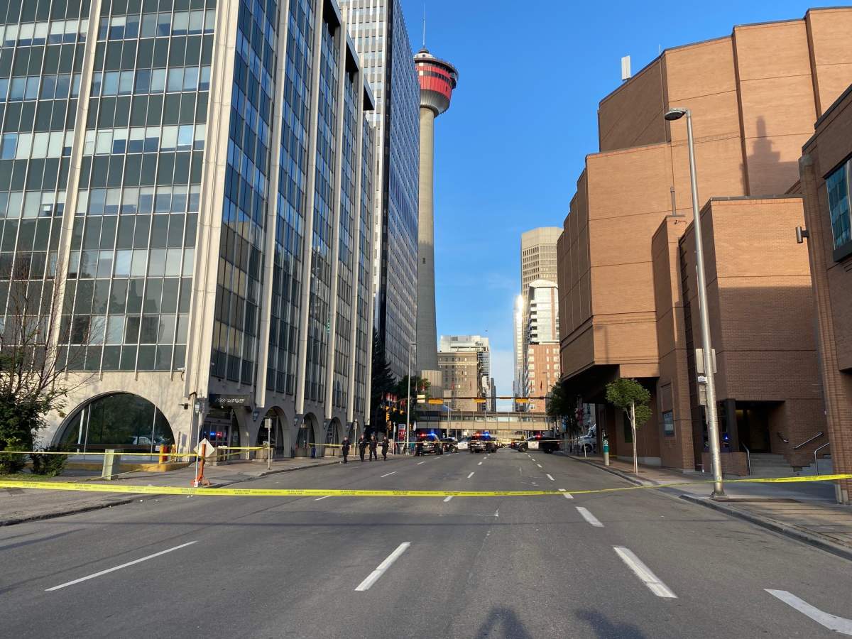 Calgary police taped off 9 Avenue SE between Centre Street and Macleod Trail after a man was hit on Monday, August 30, 2021.