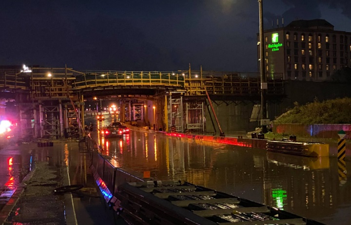 Cars can be seen in a flooded portion of Derry Road West near Mississauga Road.
