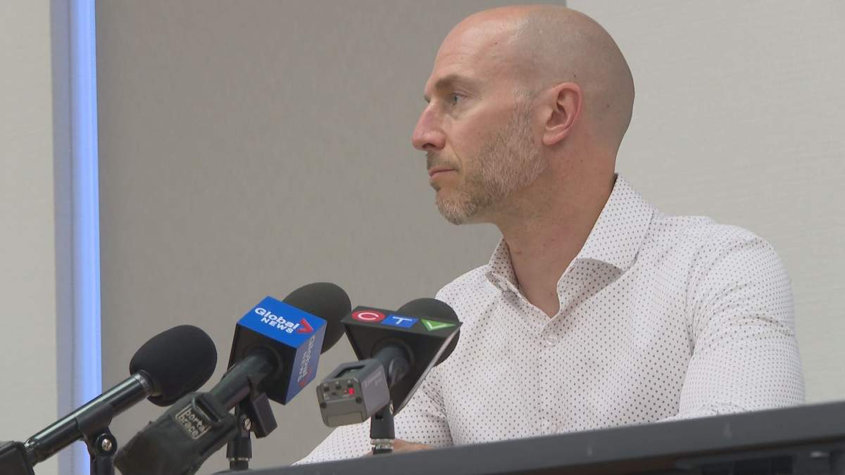 Dr. Yves Léger, the east region’s medical officer of health, takes questions from reporters at a press conference Monday, Aug. 16.