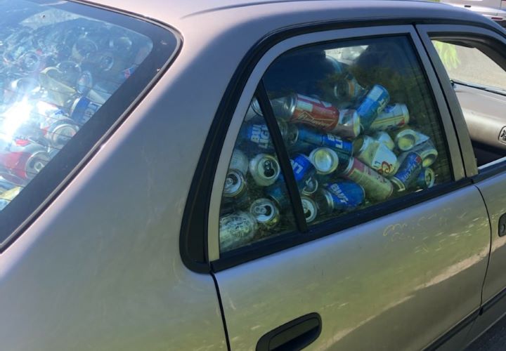 Driver stopped, charged after vehicle filled with beer cans while