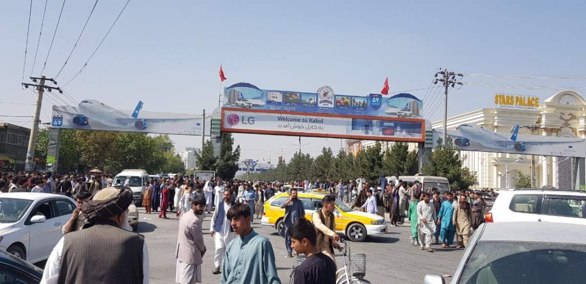 7 dead after thousands pack Kabul airport trying to flee Afghanistan amid Taliban takeover - image