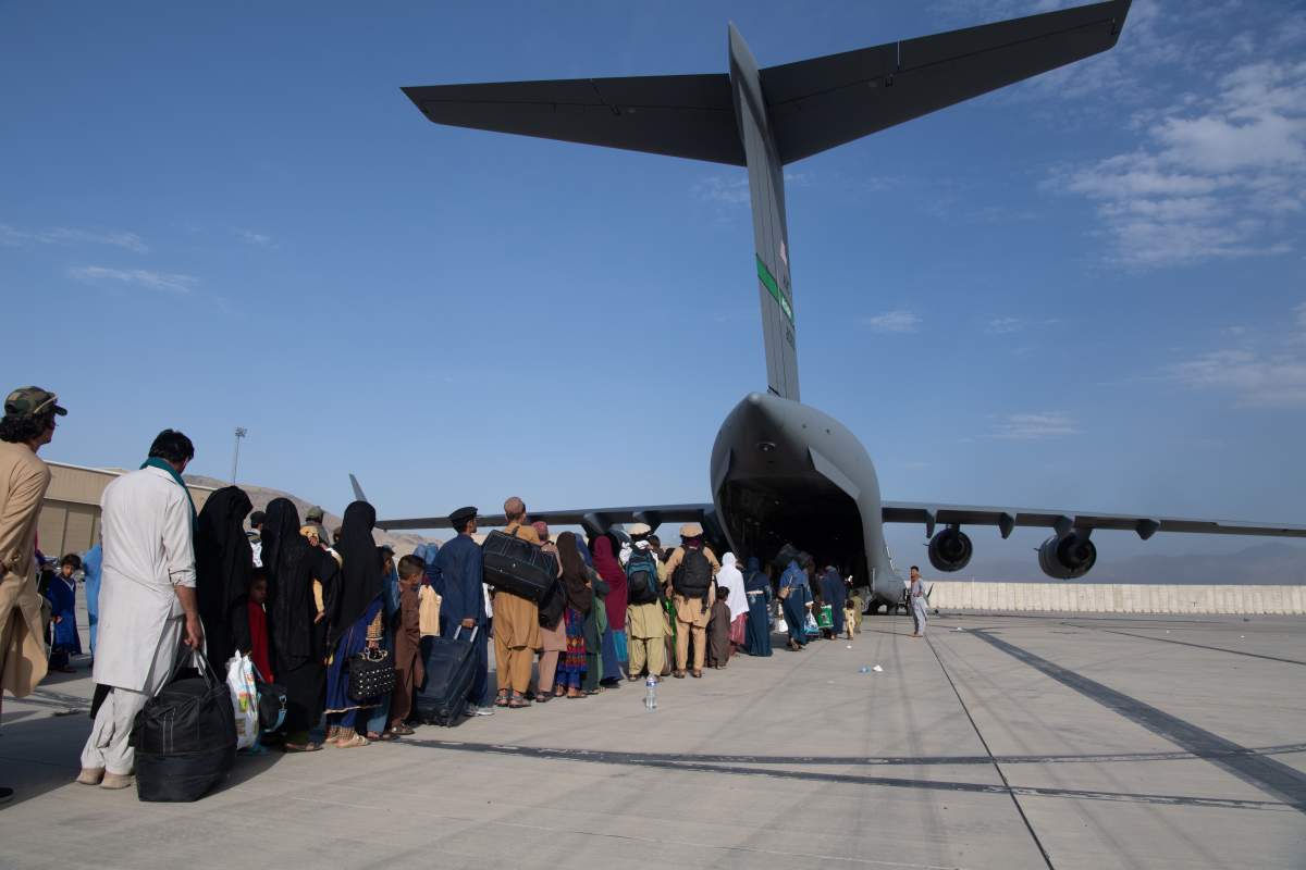 In this handout provided by U.S. Central Command Public Affairs, U.S. Air Force loadmasters and pilots assigned to the 816th Expeditionary Airlift Squadron, load passengers aboard a U.S. Air Force C-17 Globemaster III in support of the Afghanistan evacuation at Hamid Karzai International Airport (HKIA) on August 24, 2021 in Kabul, Afghanistan. The United States and allies urged Afghans to leave Kabul airport, citing the threat of terrorist attacks, as Western troops race to evacuate as many people as possible by August 31. (Photo by Master Sgt. Donald R. Allen/U.S. Air Forces Europe-Africa via Getty Images).