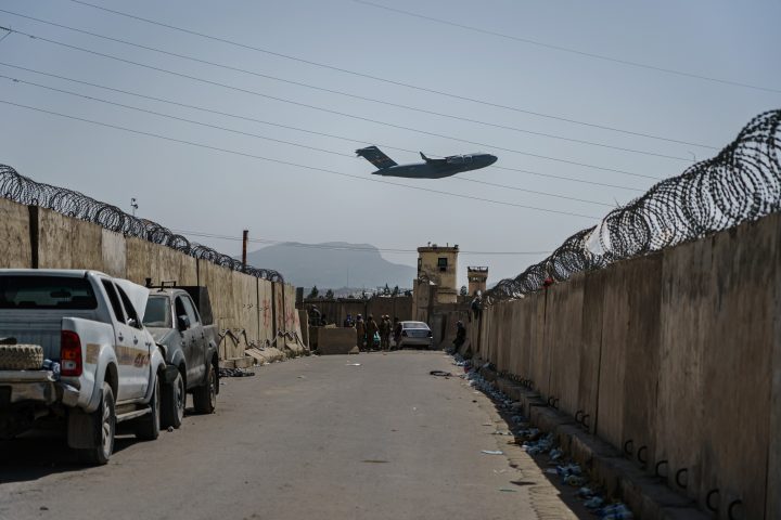 A C-17 Globemaster takes off as Taliban fighters secure the outer perimeter, alongside the American controlled side of of the Hamid Karzai International Airport in Kabul, Afghanistan, Sunday, Aug. 29, 2021.