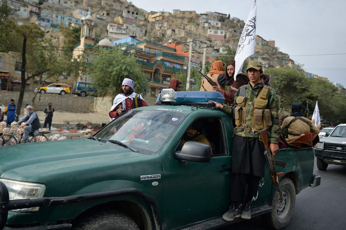 Taliban fighters on a pick-up vehicle take part in a rally in Kabul on August 31, 2021 as they celebrate after the US pulled all its troops out of the country to end a brutal 20-year war — one that started and ended with the hardline Islamist in power.