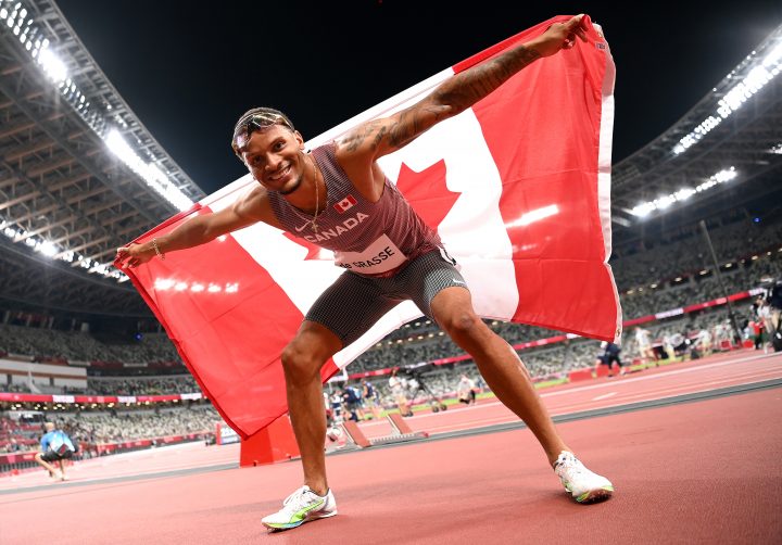 Andre De Grasse of Team Canada celebrates after winning the bronze medal in the Men's 100m Final on day nine of the Tokyo 2020 Olympic Games at Olympic Stadium on August 01, 2021 in Tokyo, Japan. 